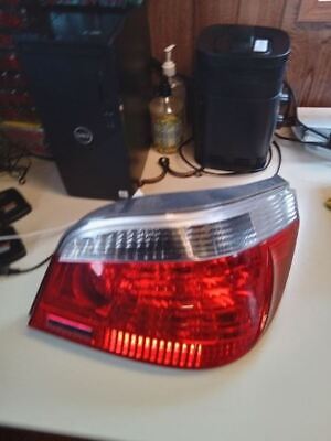 A red and white car tail light on top of a table.