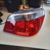 A red and white car tail light on top of a table.
