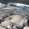 A car engine with the hood open.