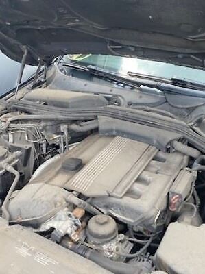 A car engine with the hood open.