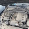 A car engine with the hood open.