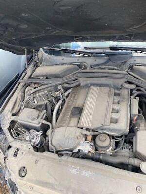 A car engine with the hood open.