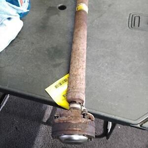 A rusty pipe sitting on top of a table.