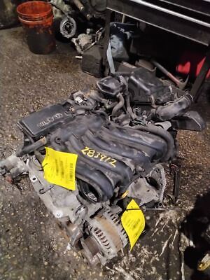 A car engine with some yellow tags on it