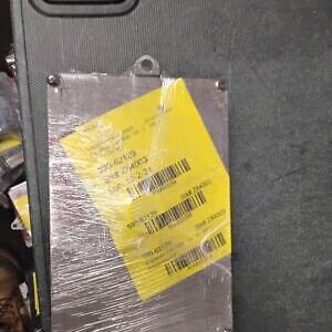 A piece of metal with a yellow tag on it.