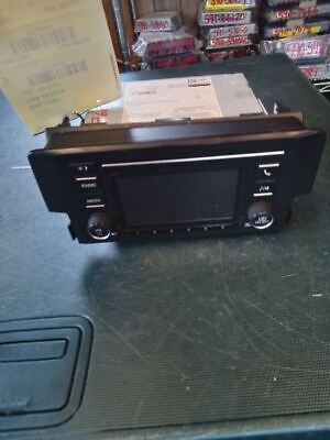 A black radio sitting on top of a table.