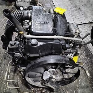 A black engine sitting on top of the ground.