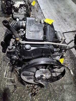 A black engine sitting on top of the ground.