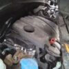 A car engine with some parts missing.