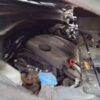 A car engine with the hood open.