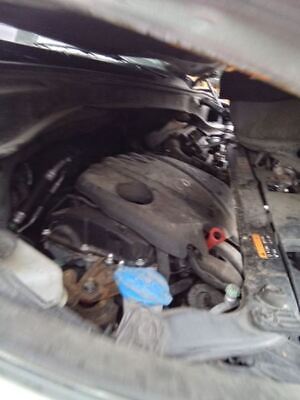 A car engine with the hood open.