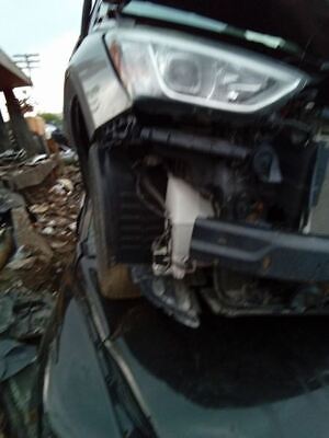 A car that has been smashed in the middle of its front end.