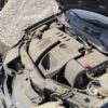 A car engine with the hood open.
