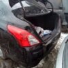 A car that has been broken down and is in the snow.