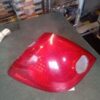 A red car tail light sitting on top of a table.