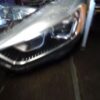 A car 's headlight is shown in the dark.
