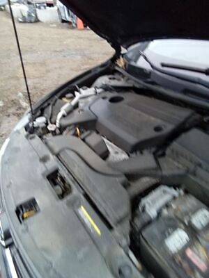 A car engine with the hood open.