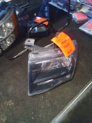 A car headlight with an orange tag on it.