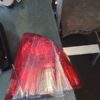 A red tail light sitting on top of a table.