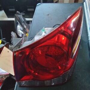 A car 's tail light is broken and sitting on the table.