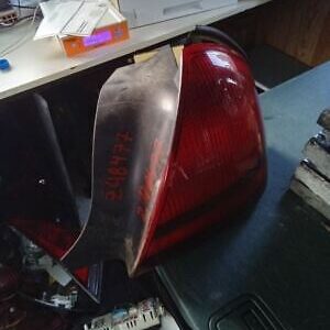 A red and black piece of plastic sitting on top of a table.