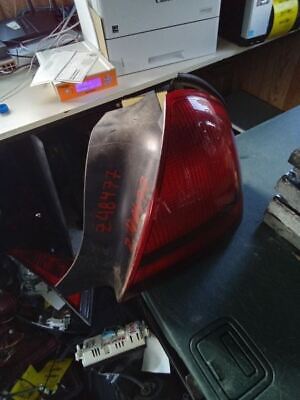 A red and black piece of plastic sitting on top of a table.