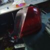 A red and black car is on the table