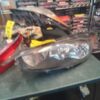A car headlight sitting on top of a table.