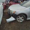 A car that has been smashed in the back of it.
