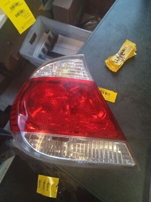 A red and white car tail light on the road