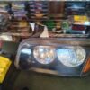 A car headlight is shown in the middle of a store.