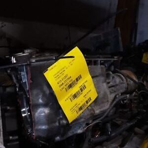 A yellow sign is attached to the side of an engine.