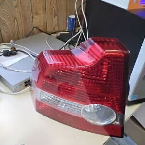 A red and white car tail light on top of a desk.