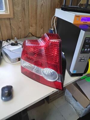 A red and white car tail light on top of a desk.