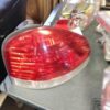A red tail light sitting on top of a table.