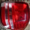 A red and white light on the side of a car.