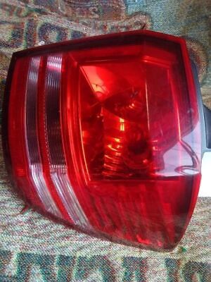 A red and white light on the side of a car.