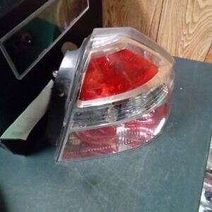 A red and white car light on top of a table.