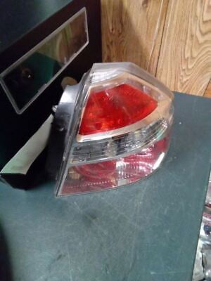 A red and white car light on top of a table.