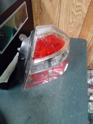 A red and white car light on top of a table.
