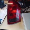 A red tail light sitting on top of a desk.