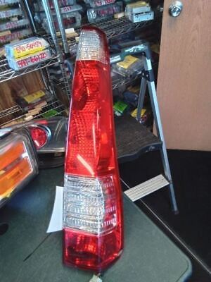 A red tail light sitting on top of a table.