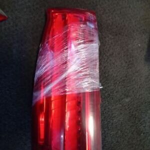 A red car tail light wrapped in plastic.