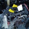 A car engine with some wires attached to it