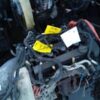 A car engine with some wires attached to it