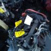 A pile of wires and other items in the middle of a room.