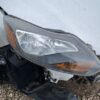 A car that has been hit by an oncoming truck.