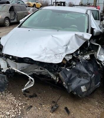 A car that has been smashed in to pieces.