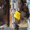A picture of an old car with a yellow tag.