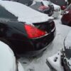 A bunch of cars parked in the snow